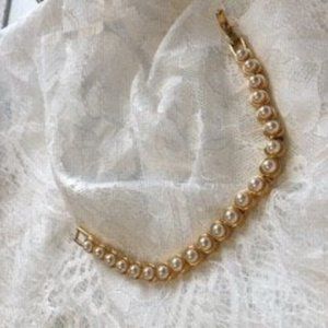 Signed MoD tennis style bracelet with white faux p